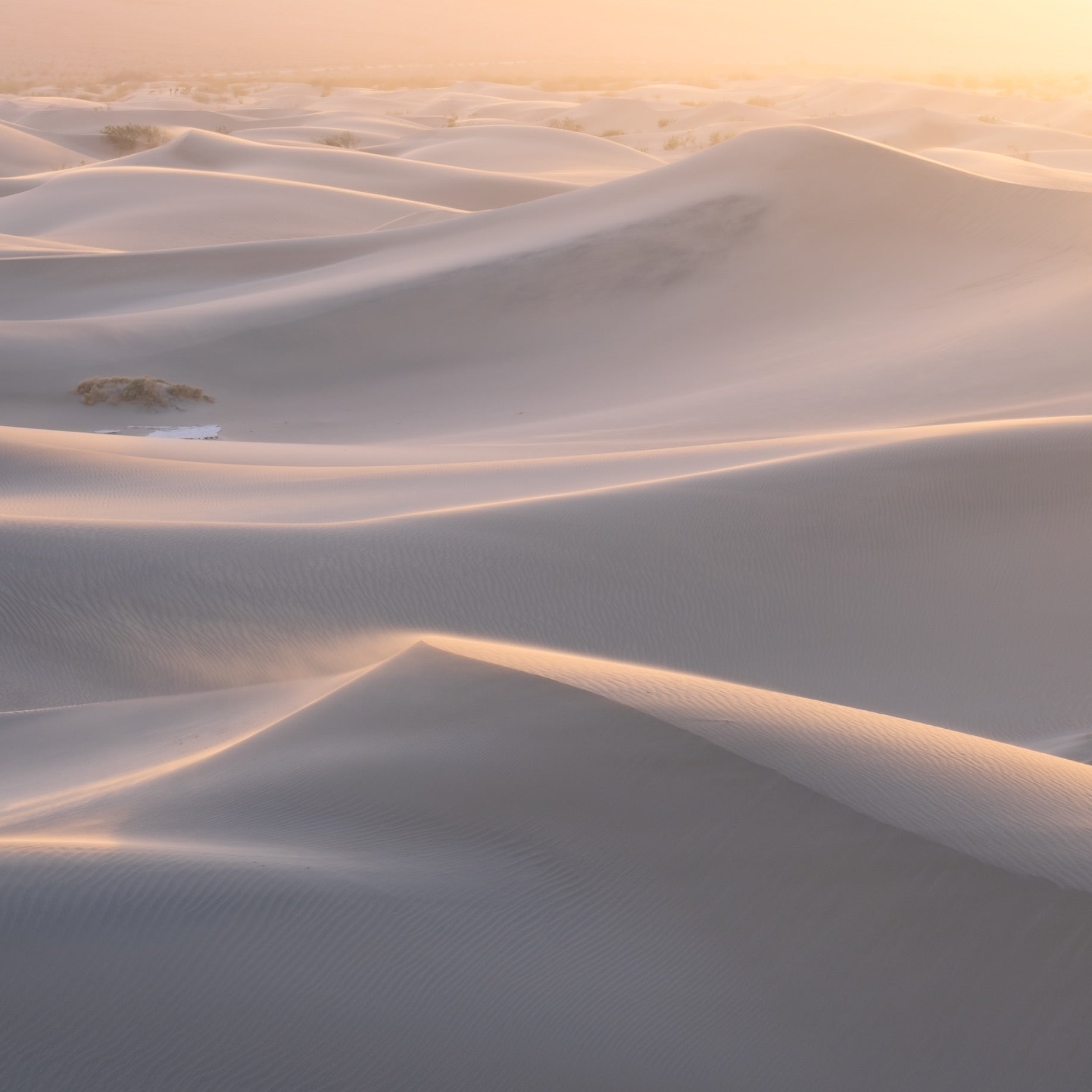 A landscape image of sand dunes after applying the Orton Effect Lightroom Preset from the Rethink Landscape presets pack